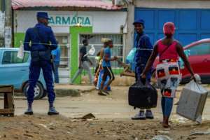 The lockdown order has largely gone unnoticed in the daily grind and hustle on the capital's streets. By Osvaldo Silva (AFP)