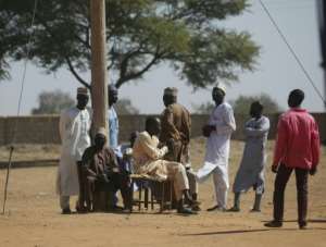 The long wait: Parents come to school every day, desperate for news about their loved ones.  By Kola Sulaimon (AFP)