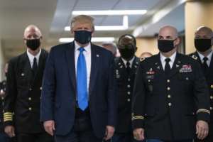The man in the presidential mask: Donald Trump wore a face mask for the first time in public. By ALEX EDELMAN (AFP)