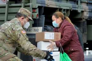 The National Guard delivers food to some communities hardest hit by the coronavirus pandemic in Chelsea, Massachusetts. By Joseph Prezioso (AFP)