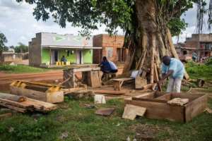 The newly minted coffin makers are now confronting a new challenge as the pandemic begins to ease. By Badru KATUMBA (AFP)