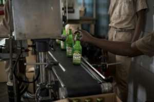 The Nkulenu factory in Accra exports Ghanaian food and drink, including palm wine.  By CRISTINA ALDEHUELA (AFP)
