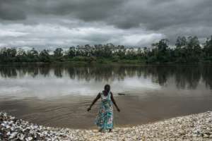 The shoreline of Nteva village is a beach of clam shells, which become the foundations for homes. By ALEXIS HUGUET (AFP)