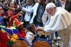 The pope finished his Saturday schedule by meeting migrants. By Alberto PIZZOLI (AFP)