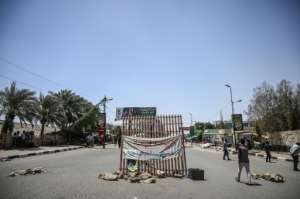 The protesters are refusing to dismantle checkpoints they have set up on roads leading to Sudan's army headquarters. By OZAN KOSE (AFP)