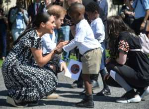 The royal couple attended an education workshop in Nyanga. The township is crippled by violence and crime. By Courtney AFRICA (POOL/AFP)