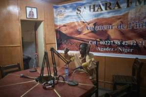 Sahara FM radio hosts provide public service information to their many listeners.  By Michèle Cattani (AFP)