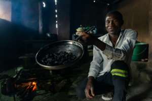 The recipe is simple -- the beetles are boiled until soft and then fried until they reach the desired level of crunchiness. By Jekesai NJIKIZANA (AFP)