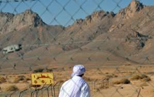 This file photo from February 2010 shows the entrance of the former French nuclear bomb test site at Ain Ekra. By Fayez Nureldine (AFP/File)