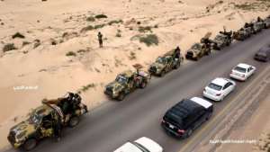 This image grab obtained from a video posted April 3, 2019 on the Facebook page of Libyan strongman Khalifa Haftar's self-proclaimed Libyan National Army War Information Division allegedly shows military convoys heading towards the capital Tripoli. By - (LNA War Information Division/AFP/File)