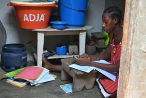 This schoolgirl in Ivory Coast is receiving lessons via Whatsapp. By ISSOUF SANOGO (AFP)