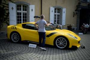 This 2015 Ferrari F12tdf Berlinetta was among those auctioned off Sunday, fetching 794,000 euros. By FABRICE COFFRINI (AFP)