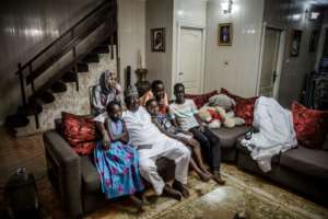 Time for TV: The Sarkin Fulani relaxes with his family. By Luis TATO (AFP)