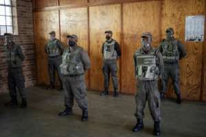 To qualify for Cortac positions, applicants need a driver's license, firearm competency and a clean criminal record. By Michele Spatari (AFP)