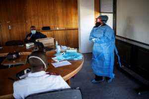 Training sessions are given on how to wear face masks properly. By Michele Spatari (AFP)