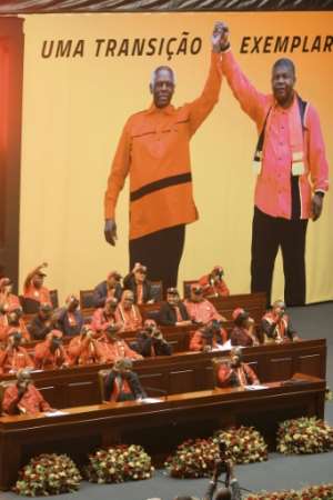 Transition: President Joao Lourenco, front row centre, and his predecessor Jose Eduardo dos Santos, front row left, at a congress of the ruling MPLA party in 2018. By AMPE ROGERIO (AFP)