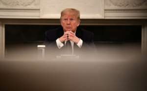 Trump said he was taking hydroxychloroquine, an anti-malaria drug his own government's experts have recommended against. By Brendan Smialowski (AFP)