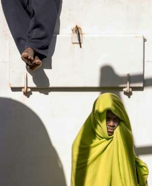 Two migrants are pictured on board the Aita Mari vessel in February after their rescue in international waters. By Pablo Garcia (AFP)