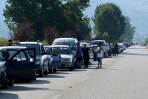 Tthousands of Albanians queued in their cars at the Greek border, hoping to squeeze across and return to work before tougher entry requirements come into effect. By Gent SHKULLAKU (AFP)