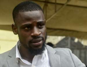 Tunde Onakoya, 24, a seasoned player himself, set up the Chess in Slums project last September. By PIUS UTOMI EKPEI (AFP)