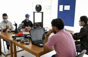 Tunisian engineers test a prototype of an artificial hand, which they hope will be produced at a lower price than existing prostheses. By Bechir TAIEB (AFP)