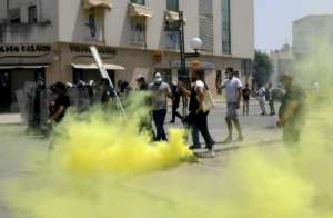 Tunisian security forces clashed with anti-government protesters in front of the parliament in the capital Tunis on July 25. By FETHI BELAID (AFP/File)