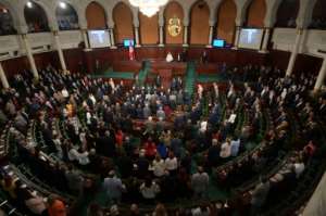 Tunisia's new President Kais Saied received a rousing round of applause from a packed parliament when he vowed to uphold women's right. By FETHI BELAID (AFP)