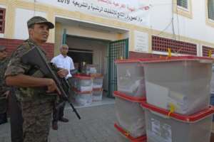 Tunisia's parliamentary election comes just before an October 13 two-way run-off in a presidential contest pitting a jailed business tycoon against a law professor. By ANIS MILI (AFP)