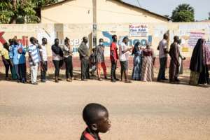 Turnout was high in Saturday's election, with people queueing for hours to vote. By JOHN WESSELS (AFP/File)