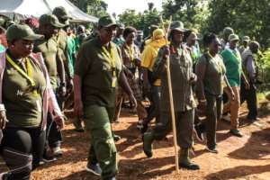 Ugandan President Yoweri Museveni and veterans and Members of Parliament, ready to march through the jungle as he retraces the route which his rebel forces took 35 years ago. By Hajarah Nalwadda (AFP)