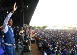 UDC leader Boko Duma greets supporters at a rally in the capital Gaborone as it seeks to unseat the historic ruling BDP party. By Monirul Bhuiyan (AFP)