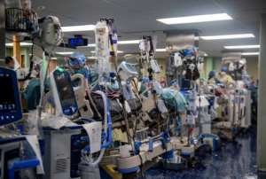 US Navy sailors aboard the hospital ship USNS Comfort (T-AH 20) treat patients in the ship's intensive care unit in New York -- the vessel cares for critical and non-critical patients without regard to their COVID-19 status. By Scott BIGLEY (US NAVY/AFP)