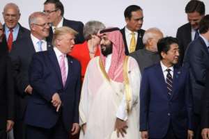 US President Donald Trump and Saudi Crown Prince Mohammed Bin Salman speak during the family photo at the G20 Osaka Summit. By Ludovic MARIN (AFP)