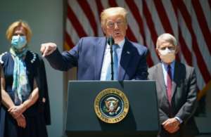 US President Donald Trump, flanked by senior helath officials, launches the high-powered 'Operation Warp Speed' initiative which he says could deliver a vaccine by the end of the year. By MANDEL NGAN (AFP)