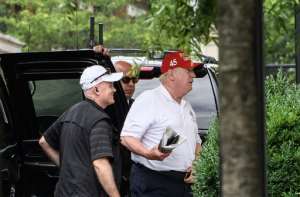 US President Donald Trump is under growing pressure to set an example by wearing a face mask. By NICHOLAS KAMM (AFP)