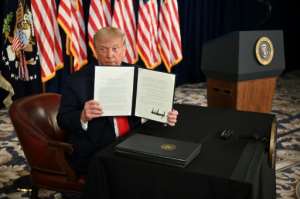 US President Donald Trump signs executive actions extending coronavirus economic relief in Bedminster, New Jersey, on August 8, 2020. By JIM WATSON (AFP)