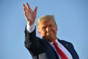 US President Donald Trump, who has refused to concede defeat, waves during an October 2020 election rally in Tucson, Arizona. By MANDEL NGAN (AFP/File)