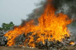 Up in smoke: Fake drugs are destroyed in Ogun State, southwest Nigeria after being seized by watchdogs. By PIUS UTOMI EKPEI (AFP)