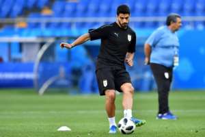 Uruguay's Luis Suarez has exited the last two World Cups in disgrace after being sent off for a handball against Ghana and infamously sinking his teeth into Italy's Giorgio Chiellini in 2014. By JOE KLAMAR (AFP)