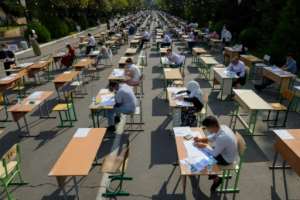 Uzbek students take open-air entrance exams in Tashkent amid the ongoing coronavirus pandemic. By Yuri KORSUNTSEV (AFP)