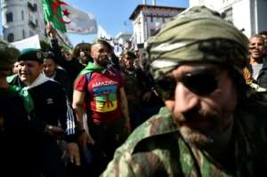 Veteran soldiers from Algeria's civil war take part in a demonstration against ailing president Abdelaziz Bouteflika in the capital Algiers on March 29, 2019. By RYAD KRAMDI (AFP/File)
