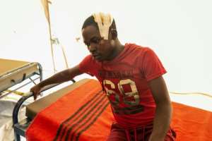 Victim: A young man recovers after being treated in a Chimanimani camp. By Jekesai NJIKIZANA (AFP)