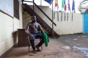 Victim: Okule Mokube Kingsley, 32, is one of the half million people who have been displaced by the conflict. He was beaten by armed men, doused with petrol and set on fire. By Daniel BELOUMOU OLOMO (AFP)