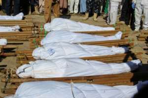 Victims: The funeral for 43 farm workers massacred by Boko Haram fighters in rice fields last November. By Audu Marte (AFP)