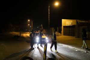 Vigilantes: Community members mount a road block in Phoenix Township. Twenty people have died in clashes. By GUILLEM SARTORIO (AFP)