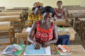 Village women are also attending classes, with the emphasis on literacy. By ISSOUF SANOGO (AFP/File)