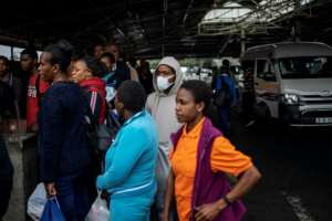 Virus worry: Some passengers at Johannesburg taxi ranks have started to don masks. By Michele Spatari (AFP)