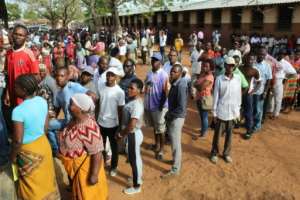 Voters lined up in long queues outside ballot stations from early Wednesday morning, with results due on Thursday.  By Roberto MATCHISSA (AFP)