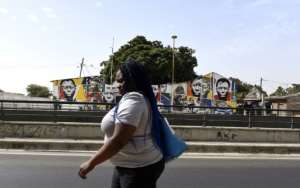 Wall murals can cause hostility as well as popularity, but the majority of local people seem to like the art. By SEYLLOU (AFP)