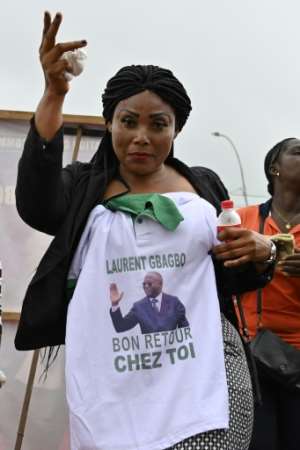 Welcome home: Gbagbo's image is emblazoned on T-shirts, caps and caftans. By SIA KAMBOU (AFP)